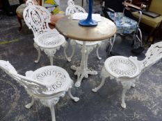 A SET OF FOUR WHITE PAINTED CAST IRON GARDEN CHAIRS WITH PIERCED CIRCULAR SEATS AND FOLIATE BACKS,