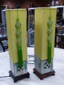 A PAIR OF CHINESE POTTERY TABLE LAMPS, THE MOTTLED GREEN SQUARE SECTIONED FORMS PIERCED WITH CASH