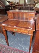 A MODERN MAHOGANY WRITING TABLE, THREE PIGEON HOLES FLANKED BY PAIRS OF DRAWERS RECESSED BEHIND