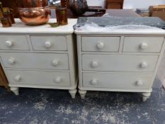 A PAIR OF PAINTED VICTORIAN STYLE CHESTS OF TWO SHORT AND TWO LONG DRAWERS ON SPINDLE FEET, EACH.