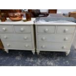 A PAIR OF PAINTED VICTORIAN STYLE CHESTS OF TWO SHORT AND TWO LONG DRAWERS ON SPINDLE FEET, EACH.