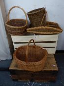 FOUR VARIOUS BASKETS, A CREAM PAINTED CRATE AND AN IRON BOUND BOX