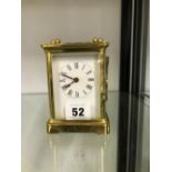 A VINTAGE BRASS CASED CARRIAGE CLOCK.