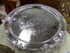 A LARGE COLLECTION OF SILVER PLATED PLATTERS WITH ARMORIAL PATTERN (10).