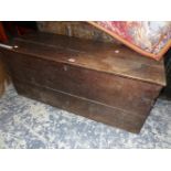 AN OAK TRUNK OR COFFER WITH IRON HANDLES TO EACH NARROW SIDE. W 106 x D 40 x H 45cms.