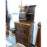 AN ANTIQUE FRENCH OAK SIDE CABINET, THE TWO SHELF BACK RECESSED ABOVE A CARVED TWO PANEL DOOR