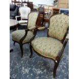 A PAIR OF STAINED WOOD FAUTEUILS, THE BACKS, ELBOW RESTS AND SERPENTINE FRONTED SEATS IN YELLOW