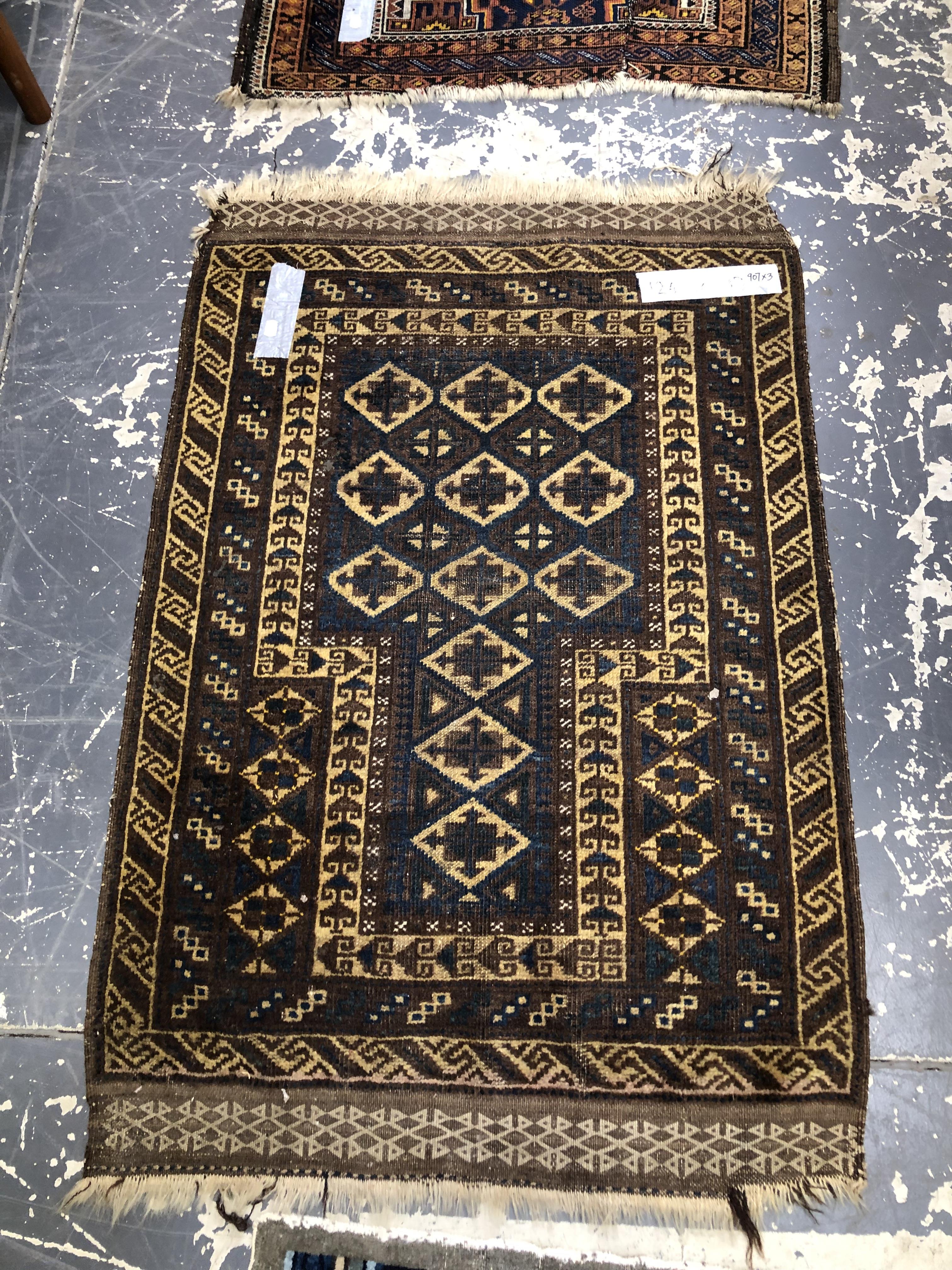 TWO BELOUCH TRIBAL RUGS. TOGETHER WITH AN ANTIQUE CHINESE RUG. 144 x 86, 124 x 83 AND 146 x 81cms ( - Image 2 of 4