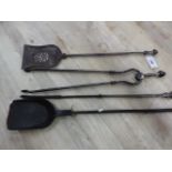 A COLLECTION OF FOUR IRON AND STEEL FIRE TOOLS, COMPRISING TWO SHOVELS, A POKER AND A PAIR OF TONGS