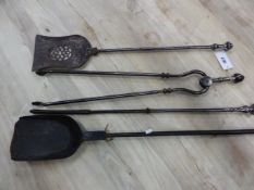 A COLLECTION OF FOUR IRON AND STEEL FIRE TOOLS, COMPRISING TWO SHOVELS, A POKER AND A PAIR OF TONGS