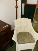 A LOOM CHAIR TOGETHER WITH A STAINED WOOD STANDARD LAMP