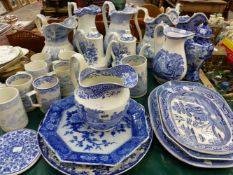 A COLLECTION OF 19th C. AND OTHER BLUE AND WHITE WASH JUGS, PLATES, PLATTERS, AND LARGE MUGS.