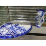 A LARGE DELFT BLUE AND WHITE WALL PLAQUE AND A DOUBLE TOBY JUG.