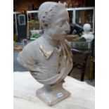 . A GEORGE III PAINTED PLASTER BUST OF A YOUNG GENTLEMAN