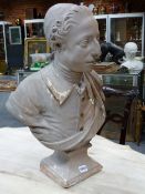 . A GEORGE III PAINTED PLASTER BUST OF A YOUNG GENTLEMAN