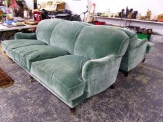 A PAIR OF THREE SEAT SETTEES UPHOLSTERED IN TURQUOISE VELVET, THE MAHOGANY LEGS ON BRASS CASTER