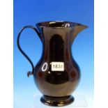 A LATE 18th/EARLY 19th C. JACKFIELD GLAZED JUG. H 21.5cms.