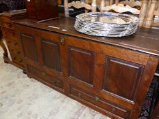 AN 18th C. OAK MULE CHEST WITH FOUR PANELS OVER TWO DRAWERS. W 141 x d 51.5 x h 73cms.