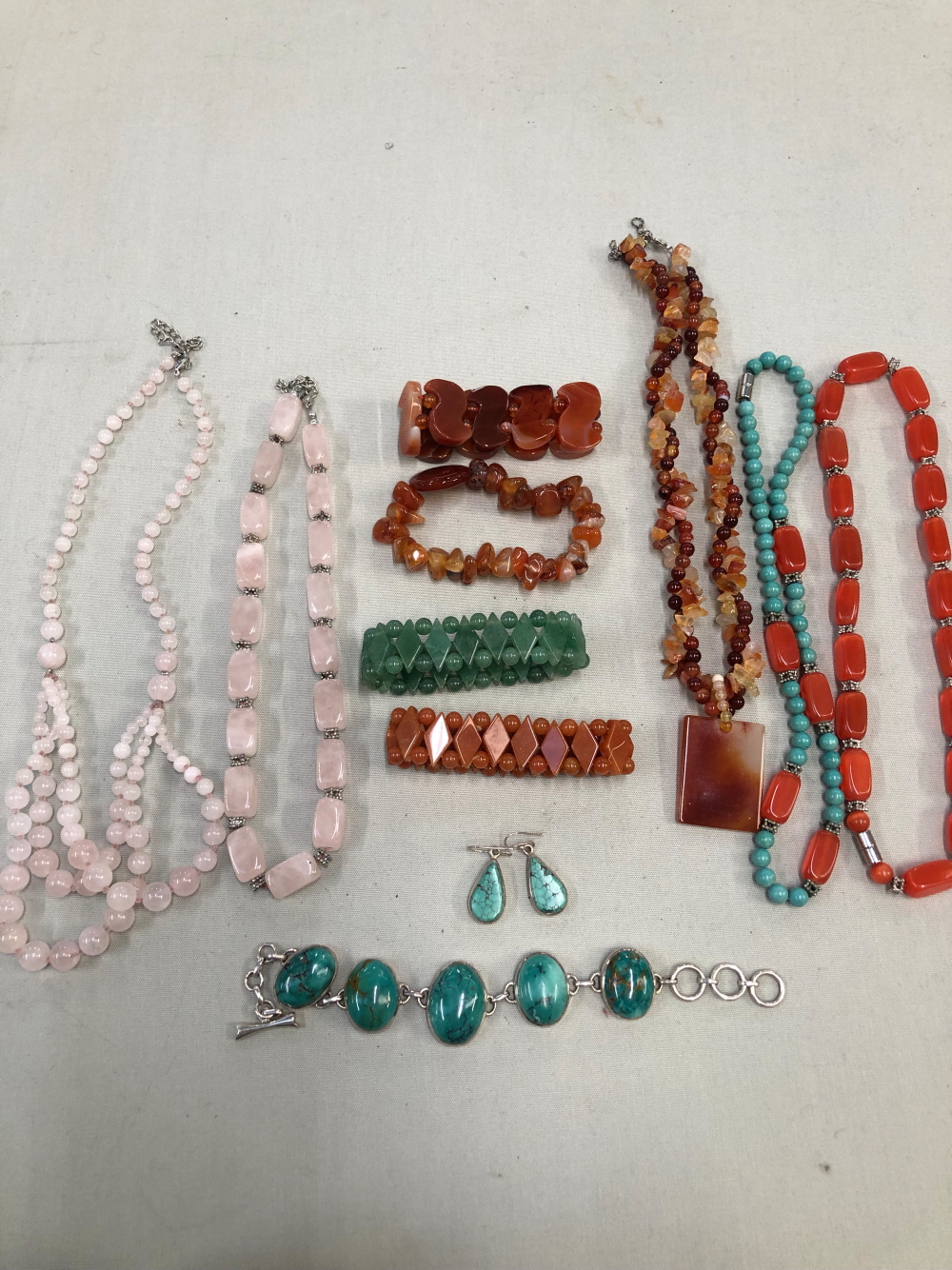 A SILVER AND TURQUOISE BRACELET, SIMILAR DROP EARRINGS, AND VARIOUS HARD STONE NECKLACES AND