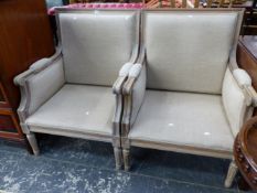 A PAIR OF MODERN PAINTED WOOD SHOW FRAME ARMCHAIRS, THE SQUARE BACKS AND SEATS UPHOLSTERED IN BEIGE