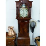 AN EARLY 19th C. MAHOGANY LONG CASED CLOCK, THE COTTAGE SATURDAY NIGHT PAINTED IN THE ARCH OF THE