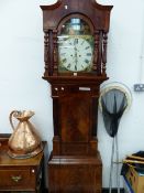 AN EARLY 19th C. MAHOGANY LONG CASED CLOCK, THE COTTAGE SATURDAY NIGHT PAINTED IN THE ARCH OF THE