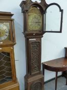 A 19th C. CARVED OAK LONG CASE CLOCK, THE ARCHED BRASS DIAL INSCRIBED WITHIN THE CHAPTER RING. H