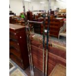 A PAIR OF CHROME TWIN COLUMN STANDS WITH PAIRS OF ARMS AT RIGHT ANGLES ADJUSTABLE IN HEIGHT WITHIN