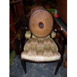 A PAIR OF REGENCY STYLE MAHOGANY ELBOW CHAIRS WITH CANED OVAL BACKS AND SEATS ON SQUARE SECTIONED