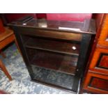 A GLAZED STAINED WOOD DISPLAY CABINET, THE DOOR ENCLOSING SHELVES. W 59 x D 24 x H 71cms.