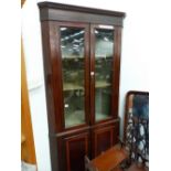 A 19th C. LINE INLAID MAHOGANY CORNER CUPBOARD, THE BLIND FRET TOP OVER GLAZED DOORS, THE BASE