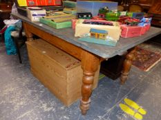 A VICTORIAN SLATE TOPPED PINE TABLE WITH A DRAWER TO EACH END ABOVE THE BALUSTER TURNED LEGS. W