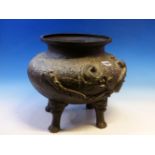 A JAPANESE BRONZE BOWL CAST WITH DRAGONS AND ON FOUR MASK AND PAW FEET. Dia.34cms.