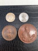 TWO LARGE BRONZED MEDALLIONS, A 1934 SILVER DOLLAR, AND A VICTORIA MEDALLION.