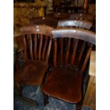 A MATCHED SET OF SIX KITCHEN CHAIRS WITH ELM SEATS AND TURNED STAINED WOOD LEGS