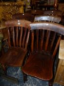 A MATCHED SET OF SIX KITCHEN CHAIRS WITH ELM SEATS AND TURNED STAINED WOOD LEGS