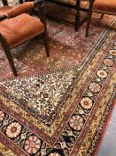 AN ORIENTAL CARPET OF PERSIAN DESIGN 372x270cms