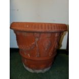 A PAIR OF LARGE TERRACOTTA PLANTERS.