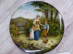 A DOULTON LAMBETH CIRCULAR WALL PLAQUE PAINTED WITH A MOTHER AND TWO CHILDREN FEEDING CHICKENS AT A