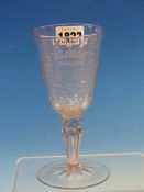 AN 18th C BOHEMIAN WINE GLASS, THE BOWL WITH ENGRAVED CROWNED MONOGRAM, THE OCTAGONAL HOLLOW STEM