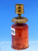 A 19th C. ORMOLU CANDLESTICK WITH FOLIATE DRIP PAN ABOVE A RED CRYSTALLINE CYLINDRICAL BASE. H 14.