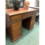 A LATE 19th C. MAHOGANY PEDESTAL DESK WITH A BLIND FRET BAND ENCLOSING THE RED LEATHER INSET TOP,