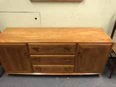 AN ERCOL PALE ELM SIDEBOARD