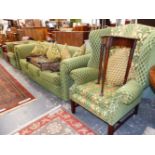 A THREE SEAT SETTEE UPHOLSTERED IN YELLOW DIAMOND DIAPERED GREEN TEXTILE, A WING ARMCHAIR AND