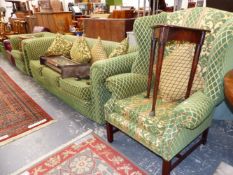 A THREE SEAT SETTEE UPHOLSTERED IN YELLOW DIAMOND DIAPERED GREEN TEXTILE, A WING ARMCHAIR AND