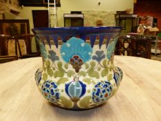 A BURMANTOFTS PLANTER MOULDED IN RELIEF AND PAINTED WITH IZNIK FLOWERS ON A WHITE GROUND, THE RIM