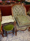 A VICTORIAN WALNUT CARVED SHOW FRAME ARM CHAIR AND A COMPARTMENTAL FOOT STOOL UPHOLSTERED ENSUITE