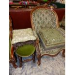 A VICTORIAN WALNUT CARVED SHOW FRAME ARM CHAIR AND A COMPARTMENTAL FOOT STOOL UPHOLSTERED ENSUITE