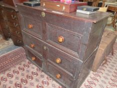 A 17th C. AND LATER COFFER TOPPED CHEST OF THREE DRAWERS ON PLINTH FOOT. W 109 x D 46 x H 92cms.