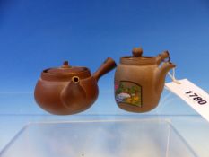 TWO CHINESE YIXING TEA POTS BOTH WITH HANDLES PIERCED WITH CASH MEDALLIONS, ONE PAINTED WITH FAMILLE